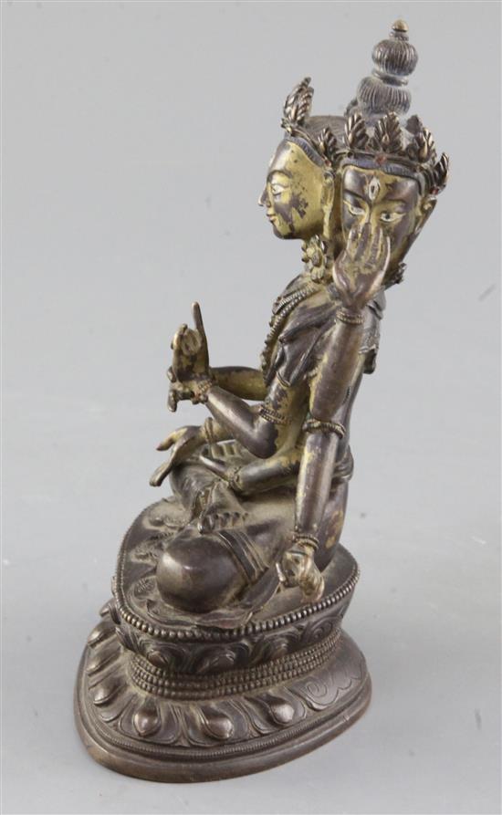 A Sino-Tibetan parcel gilt bronze seated figure of Avalokiteshvara, 18cm